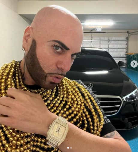 Hard Rock Nick showcasing his mercedes and jewelry